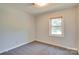 Bright bedroom with carpeting and a window providing plenty of natural light at 904 Sunbeam Dr, Lincolnton, NC 28092
