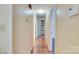 Long hallway with wood flooring and ample storage with built-in shelving at 904 Sunbeam Dr, Lincolnton, NC 28092