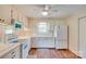 Bright kitchen with white cabinetry, appliances, and a view of the backyard at 904 Sunbeam Dr, Lincolnton, NC 28092