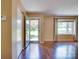 Bright living room featuring hardwood floors and a view of the front yard at 904 Sunbeam Dr, Lincolnton, NC 28092