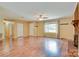 Large living area with brick fireplace, hardwood floors and lots of natural light at 904 Sunbeam Dr, Lincolnton, NC 28092