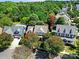 An aerial view of a neighborhood surrounded by mature trees showcasing the neighborhood's tranquil setting at 908 Gardenia St, Fort Mill, SC 29708