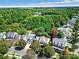 An aerial view of the neighborhood showcases the beautifully landscaped homes nestled amongst the mature trees at 908 Gardenia St, Fort Mill, SC 29708