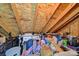 Spacious attic providing storage, with exposed beams, a vanity, and various household items at 908 Gardenia St, Fort Mill, SC 29708