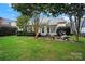 Picture of a beautiful backyard featuring a brick patio, outdoor furniture, a grill, and lush green grass at 908 Gardenia St, Fort Mill, SC 29708