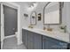 Elegant bathroom with double sinks, decorative mirrors, and stylish fixtures at 908 Gardenia St, Fort Mill, SC 29708