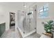 Contemporary bathroom with glass shower, patterned tile, and neutral color scheme at 908 Gardenia St, Fort Mill, SC 29708