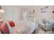 Inviting bedroom with a soft pink color palette and cozy armchair at 908 Gardenia St, Fort Mill, SC 29708