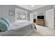 Serene bedroom with soft blue walls and natural light at 908 Gardenia St, Fort Mill, SC 29708