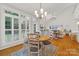 Sunlit dining area with a round table and large windows overlooking the outdoors at 908 Gardenia St, Fort Mill, SC 29708