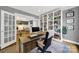 Home office featuring a built-in bookshelf and a desk overlooking the living spaces at 908 Gardenia St, Fort Mill, SC 29708