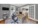Home office featuring a desk, modern chair, and a view into the living room at 908 Gardenia St, Fort Mill, SC 29708