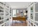 Home office with built-in bookshelves, natural light, and a view of the yard at 908 Gardenia St, Fort Mill, SC 29708