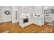 Efficient kitchen featuring white cabinets, stainless microwave, and hardwood flooring at 908 Gardenia St, Fort Mill, SC 29708