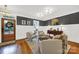 Cozy living room with hardwood floors, wainscotting, designer paint, and comfortable seating at 908 Gardenia St, Fort Mill, SC 29708