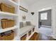 Cozy mudroom area with built-in bench, storage baskets, and decor at 908 Gardenia St, Fort Mill, SC 29708