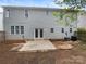 Spacious backyard with a patio and partial fencing, provides room for outdoor activities and relaxation at 9527 Scotland Hall Ct, Charlotte, NC 28277