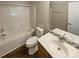 Bathroom featuring laminate flooring, tub/shower combo and single sink vanity at 9527 Scotland Hall Ct, Charlotte, NC 28277