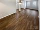 Bright living space with wood floors, featuring an inviting view of the front of the property at 9527 Scotland Hall Ct, Charlotte, NC 28277