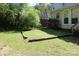 Grassy backyard outlined with timbers, perfect for outdoor relaxation at 9915 Lottie Ln, Charlotte, NC 28262