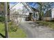 Charming home with an attached garage and an inviting entrance, complemented by a well-maintained driveway at 9915 Lottie Ln, Charlotte, NC 28262