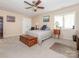 Spacious bedroom with a ceiling fan, neutral carpet, and a comfortably made queen-size bed at 1022 Kenilworth Nw Ct, Concord, NC 28027