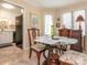 Cozy dining area featuring a glass table and a view into the kitchen at 1022 Kenilworth Nw Ct, Concord, NC 28027
