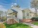 Inviting two-story home with a raised deck, brick foundation, and landscaped yard at 1022 Kenilworth Nw Ct, Concord, NC 28027