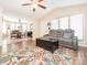 Open living room leading to dining area, with hardwood floors and a neutral color palette at 1022 Kenilworth Nw Ct, Concord, NC 28027
