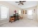 Home office with neutral walls, carpet, a computer desk, and natural light from two windows at 1022 Kenilworth Nw Ct, Concord, NC 28027