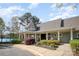 Community clubhouse with a charming front porch, beautiful landscaping, and a welcoming entrance for residents at 107 Iris Meadow Dr, Mooresville, NC 28115