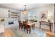 Cozy dining area featuring custom cabinetry, natural light, and a modern light fixture at 107 Iris Meadow Dr, Mooresville, NC 28115