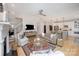 Open-concept living room showcasing a comfortable seating area, modern decor, and seamless flow to the kitchen at 107 Iris Meadow Dr, Mooresville, NC 28115