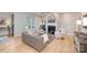 Relaxing living room with a stylish fireplace, comfortable seating, and plenty of natural light at 107 Iris Meadow Dr, Mooresville, NC 28115