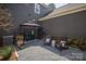 Cozy patio area featuring comfortable seating and a built-in grill, perfect for outdoor entertaining at 107 Iris Meadow Dr, Mooresville, NC 28115