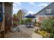 Outdoor patio featuring a table, chairs, landscaping, and beautiful scenery at 107 Iris Meadow Dr, Mooresville, NC 28115