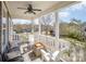Covered front porch featuring comfortable seating and neighborhood views at 107 Iris Meadow Dr, Mooresville, NC 28115