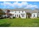 Well-maintained backyard with a manicured lawn and white townhouse exterior at 125 Snead Rd # 60, Fort Mill, SC 29715