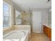 Bright bathroom featuring large tub, walk-in shower, and double vanity at 125 Snead Rd # 60, Fort Mill, SC 29715