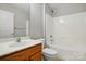 Clean bathroom with a shower-tub combo, single sink vanity with storage, and neutral tile flooring at 125 Snead Rd # 60, Fort Mill, SC 29715