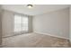 Bright and spacious bedroom with carpet flooring and a sunlit window at 125 Snead Rd # 60, Fort Mill, SC 29715