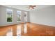 A spacious bedroom boasts gleaming hardwood floors and an abundance of natural light at 125 Snead Rd # 60, Fort Mill, SC 29715
