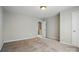 Neutral bedroom featuring carpet, an overhead light fixture, and a door to a bathroom at 125 Snead Rd # 60, Fort Mill, SC 29715