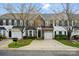 Brick townhome featuring a one-car garage and landscaped front yard at 125 Snead Rd # 60, Fort Mill, SC 29715