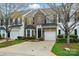 Charming brick townhome with a well-manicured lawn and attached one-car garage at 125 Snead Rd # 60, Fort Mill, SC 29715