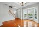 Bright foyer features gleaming hardwood floors, a staircase, and a charming bay window at 125 Snead Rd # 60, Fort Mill, SC 29715