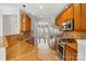 Well-lit kitchen features stainless steel appliances and warm wooden cabinetry at 125 Snead Rd # 60, Fort Mill, SC 29715