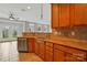 Open kitchen design includes stainless steel dishwasher and breakfast bar at 125 Snead Rd # 60, Fort Mill, SC 29715