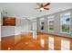 Open-concept space with hardwood floors, connecting the dining area and living room at 125 Snead Rd # 60, Fort Mill, SC 29715