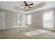 Large main bedroom featuring ensuite bathroom, neutral paint, and bright windows at 125 Snead Rd # 60, Fort Mill, SC 29715